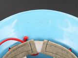 a close up of a blue bowl with a red string