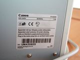 a label on the back of a computer that says canon