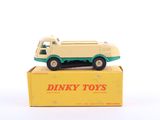 an old toy truck sitting on top of a box on a white surface