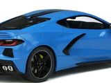 a close up of a blue sports car on a white background