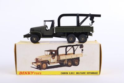 a toy truck with a crane on top of it in a box