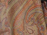 a close up of a paisley pattern on a scarf