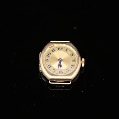 a watch that is sitting on a black surface