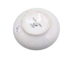 a white bowl with a black and white design on it