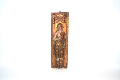 carved wooden plaque of a woman holding a child