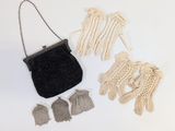 a small bag and some gloves on a white surface