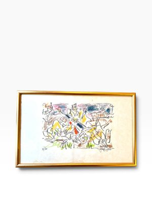 tableau accroché au mur d'une pièce blanche, dans un cadre doré