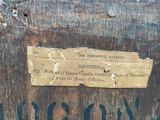 a piece of paper on the side of a wooden box