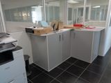 a small office with a lot of boxes on the counter