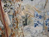 a picture of a tapestry hanging on a wall in a room