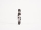 a black and white vase with a number on it