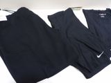 two pairs of black nike leggings on a white table