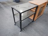 a table with a glass top and a metal frame
