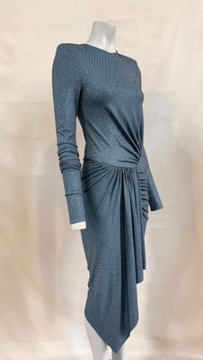 the mannequin is wearing a gray dress with a knot around the waist