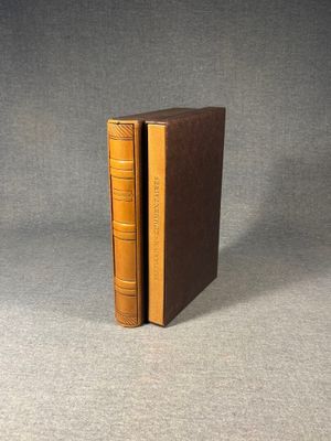 two books sitting on top of each other on a table