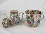 pair of chinese porcelain vases and a teapot on a white background