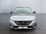 the front view of a silver car parked in a room