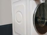 a white washer and dryer sitting on top of each other