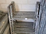 a lot of metal bars stacked up in a room