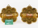 pair of gold plated wall sconces with red and green stones