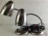 two lamps that are sitting on top of a table