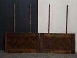 two pieces of wood on the floor next to each other