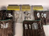 a lot of silverware in a bag on the table