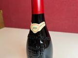 a bottle of wine that is sitting on a table