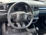 the interior of a car with a steering wheel and dashboard controls
