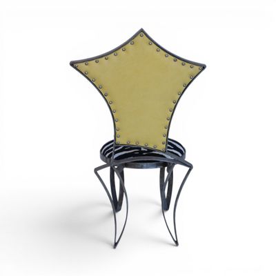 a black and yellow chair sitting on top of a white floor