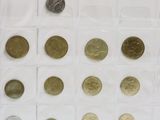 a lot of coins that are in a clear box