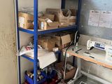 a sewing machine sitting on top of a shelf in a room