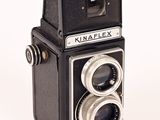 a black and white photo of an old camera