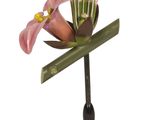 a small vase with a flower on it on a stand