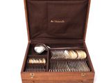 a wooden box with silverware in it on a white background