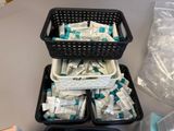 two baskets filled with medicine pills on a table