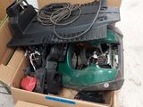 a box full of assorted items sitting on the ground