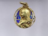 a close up of a gold medal with a blue background