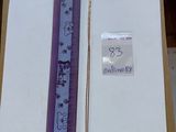 a picture of a piece of paper with a ruler attached to it