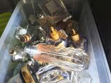 a plastic container filled with bottles and bottles on a table