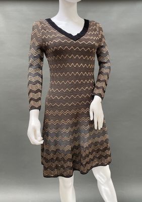 a mannequin wearing a brown and black dress on a mannequin mannequin