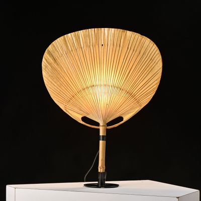 a lamp that is on top of a white box