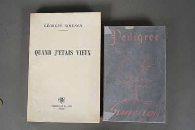a couple of books sitting on top of a table next to each other