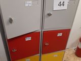 a stack of lockers in a room with a fire hydrant in the background
