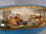 a blue bowl with a picture of a couple and a dog