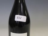 a bottle of wine that is sitting on a table