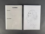 an open notebook with a drawing of a man ' s face on it
