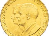 une image montrant un gros plan d'une pièce d'or sur laquelle figurent deux hommes