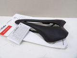 a black saddle on top of a piece of paper