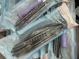 many different types of scissors in a plastic container